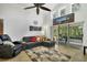 Spacious Gathering room featuring a comfortable sectional sofa and access to a screened lanai at 1122 Vinetree Dr, Brandon, FL 33510