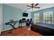 Bedroom with wood floors, a desk, and large windows at 1122 Vinetree Dr, Brandon, FL 33510