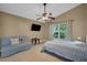 Comfortable bedroom with a queen bed, ceiling fan, and large window at 1122 Vinetree Dr, Brandon, FL 33510