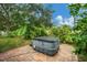 Hot tub on a brick patio surrounded by lush landscaping at 1122 Vinetree Dr, Brandon, FL 33510