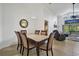 Spacious dining room with a marble table and seating for six at 1122 Vinetree Dr, Brandon, FL 33510