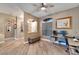 Living room features hardwood floors, ceiling fan, and home office at 1926 Rutherford Dr, Dover, FL 33527