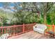Wooden deck with a white wicker chair overlooking a calm river at 1905 E Mulberry Dr # 2, Tampa, FL 33604