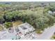 Aerial view of a duplex near a waterway, surrounded by lush greenery at 1905 E Mulberry Dr # 2, Tampa, FL 33604