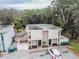 Aerial view of a duplex with a parking area and surrounding trees at 1905 E Mulberry Dr # 2, Tampa, FL 33604