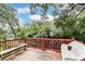 Wooden deck overlooking a peaceful river, shaded by trees at 1905 E Mulberry Dr # 2, Tampa, FL 33604