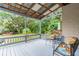 Covered deck with comfortable seating, overlooking the backyard at 1905 E Mulberry Dr # 2, Tampa, FL 33604