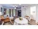 Living room with seating area and dining table, access to backyard patio at 1905 E Mulberry Dr # 2, Tampa, FL 33604