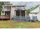 Two-story home with a spacious deck and lush landscaping at 1905 E Mulberry Dr # 2, Tampa, FL 33604
