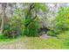 Lush green landscape with a tranquil creek at 1905 E Mulberry Dr # 2, Tampa, FL 33604