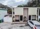 Aerial view of a multi-unit building with parking and trees at 1905 E Mulberry Dr # 2, Tampa, FL 33604