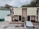 Aerial shot of a multi-unit building with parking and trees at 1905 E Mulberry Dr # 2, Tampa, FL 33604