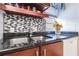 Modern kitchen features granite countertops, stainless steel sink, and stylish backsplash at 1905 E Mulberry Dr # 2, Tampa, FL 33604