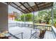 Covered deck with comfortable seating, overlooking the backyard at 1905 E Mulberry Dr # 2, Tampa, FL 33604