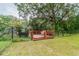 Wooden deck overlooking a tranquil waterway, surrounded by lush greenery at 1905 E Mulberry Dr # 2, Tampa, FL 33604