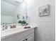 Simple bathroom with white vanity and decorative wall art at 1905 E Mulberry Dr # 2, Tampa, FL 33604