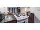 Kitchen with granite countertops, white appliances, and view into living room at 1905 E Mulberry Dr # 2, Tampa, FL 33604