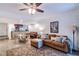 Living room features a brown sectional sofa and a piano at 1905 E Mulberry Dr # 2, Tampa, FL 33604