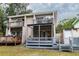 Two-story home with a spacious deck and lush landscaping at 1905 E Mulberry Dr # 2, Tampa, FL 33604