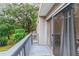 Private balcony with sliding glass doors, overlooking the lush trees at 1905 E Mulberry Dr # 2, Tampa, FL 33604