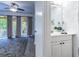 Clean bathroom with white vanity and access to the living room at 1905 E Mulberry Dr # 2, Tampa, FL 33604