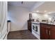 Modern kitchen with white appliances and dark wood cabinets at 1905 E Mulberry Dr # 2, Tampa, FL 33604