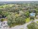 Aerial view of property showing surrounding trees and neighborhood at 1905 E Mulberry Dr # 2, Tampa, FL 33604