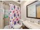 Bathroom with shower/tub combo and floral shower curtain at 1905 E Mulberry Dr # 1, Tampa, FL 33604