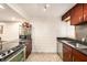 Modern kitchen features stainless steel appliances and granite countertops at 1905 E Mulberry Dr # 1, Tampa, FL 33604