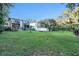 Large backyard with lush grass and mature trees at 1905 E Mulberry Dr # 1, Tampa, FL 33604