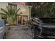 Modern building exterior with lush tropical landscaping and electric vehicle charging station at 1905 E Mulberry Dr # 1, Tampa, FL 33604