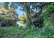 Wooden deck overlooking a tranquil river, surrounded by lush greenery at 1905 E Mulberry Dr # 1, Tampa, FL 33604