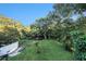 Spacious backyard with lush grass and mature trees at 1905 E Mulberry Dr # 1, Tampa, FL 33604