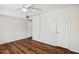 Simple bedroom featuring wood flooring and a closet at 7585 Abonado Rd, Tampa, FL 33615