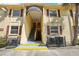 Building exterior with stairs, awning, and red shutters at 7585 Abonado Rd, Tampa, FL 33615