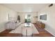 Living room with wood floors and access to patio at 7585 Abonado Rd, Tampa, FL 33615