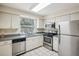 Kitchen with stainless steel appliances and ample counter space at 7585 Abonado Rd, Tampa, FL 33615