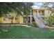 Building exterior view with stairs and lawn at 7585 Abonado Rd, Tampa, FL 33615