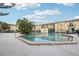 Refreshing community pool with surrounding patio and lush landscaping at 7585 Abonado Rd, Tampa, FL 33615