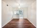 Empty dining room with hardwood floors and chandelier at 7585 Abonado Rd, Tampa, FL 33615