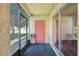 Cozy screened porch with a door and sliding glass doors at 7585 Abonado Rd, Tampa, FL 33615