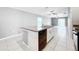 Kitchen island with granite countertop and stainless steel dishwasher at 10229 Summer Kiss Ave, Riverview, FL 33578