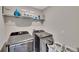 Laundry room with washer, dryer, and ample shelving at 12716 Hampton Hill Dr, Riverview, FL 33578