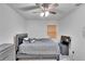 Bright bedroom with a double bed, dresser, and ceiling fan at 1404 E Frances Ave, Plant City, FL 33563