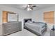 Bedroom with double bed, dresser and ceiling fan at 1404 E Frances Ave, Plant City, FL 33563