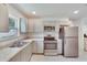 Modern kitchen with stainless steel appliances and granite countertops at 1404 E Frances Ave, Plant City, FL 33563