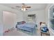 Bedroom with double bed, nightstand and ceiling fan at 1404 E Frances Ave, Plant City, FL 33563