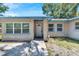 House exterior with a front door and landscaping at 1404 E Frances Ave, Plant City, FL 33563
