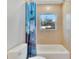Clean bathroom featuring a shower/tub combo and a window at 1404 E Frances Ave, Plant City, FL 33563