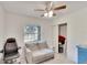 Bedroom with couch, office chair and ceiling fan at 1404 E Frances Ave, Plant City, FL 33563